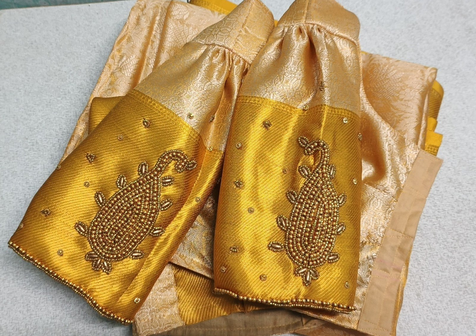 Traditional South Indian pattu saree blouse with rich aari work styling