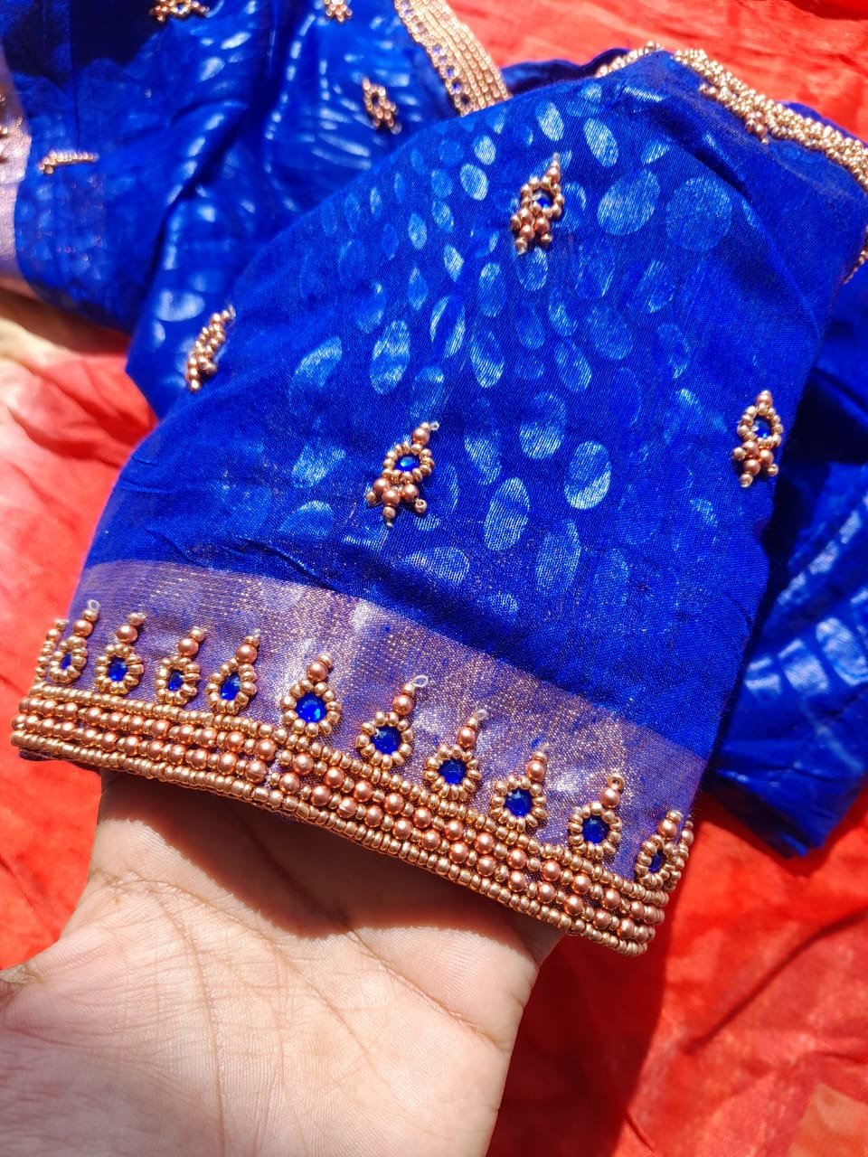 Navy blue silk blouse with dense aari embroidery and gold pearl chains